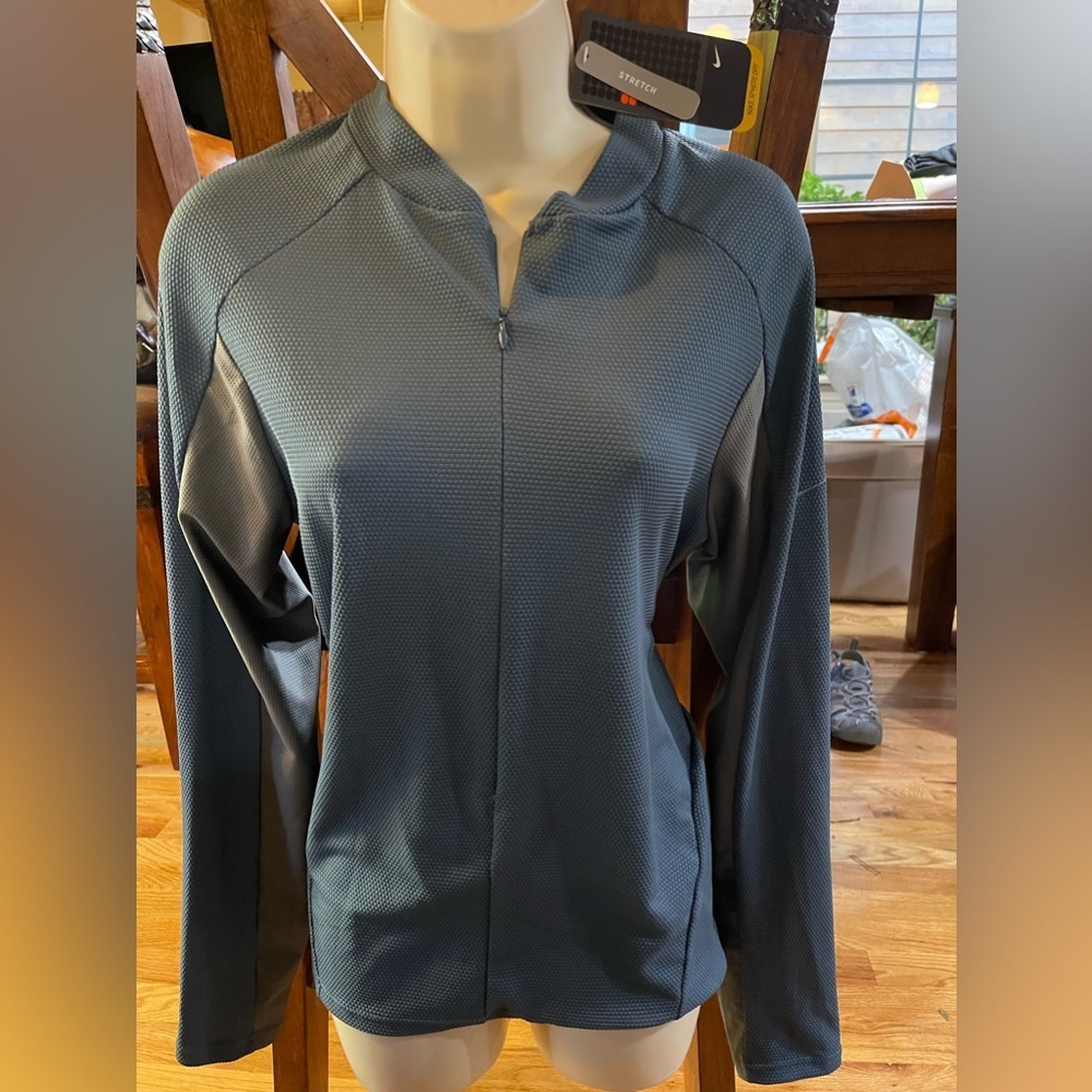 Nike XL NWT jacket running or biking with pockets for water, etc